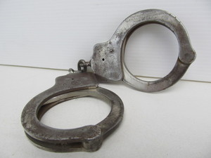 lot 175 image: Set of Orig Antique PEERLESS Handcuffs