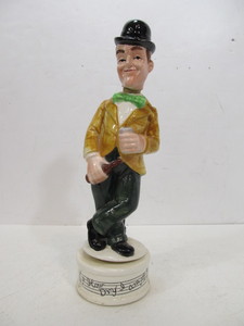lot 213 image: Vintage STAN LAUREL Musical Decanter