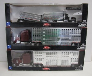 lot 253 image: 3 Large Diecast PETERBUILT Semi Trucks