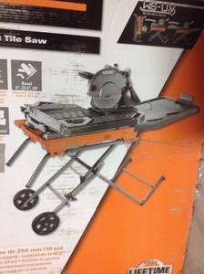 lot 54 image: RIDGID 10 in. Wet Tile Saw with Stand used in working conditions