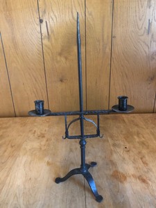 lot 33 image: ANTIQUE CAST IRON CANDLE HOLDER