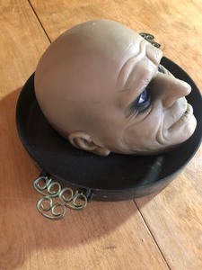 lot 123 image: MONSTER HEAD IN FRYING PAN HALLOWEEN DECOR. TALKS AND WORKS