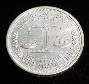lot 24 image: 1 TROY OZ. .999 FINE SILVER MORGAN DESIGN TRADE UNIT