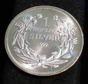 lot 37 image: 1 TROY OZ. .999 FINE SILVER SEATED DOLLAR DESIGN