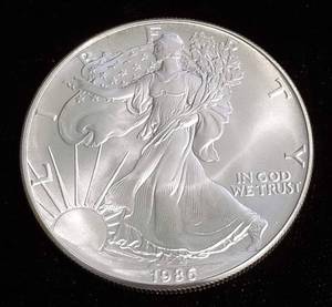 lot 52 image: 1986 AMERICAN SILVER EAGLE 1 TROY OZ. .999 FINE SILVER DOLLAR