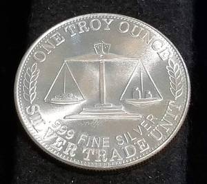 lot 56 image: 1 TROY OZ. .999 FINE SILVER 1988 NORTHWEST TERRITORIAL MINT TRADE UNIT