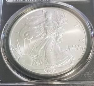 lot 59 image: 2003 AMERICAN SILVER EAGLE 1 TROY OZ. .999 FINE SILVER MS69 PCGS FIRST STRIKE