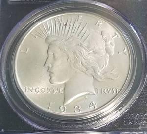 lot 12 image: 1934 PEACE SILVER DOLLAR MS64 PCGS BETTER DATE COIN