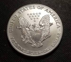 lot 15-A image: 1990 AMERICAN SILVER EAGLE 1 TROY OZ. .999 FINE SILVER DOLLAR