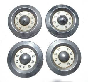 lot 165 image: Set of Four Vintage Ford Hubcaps
