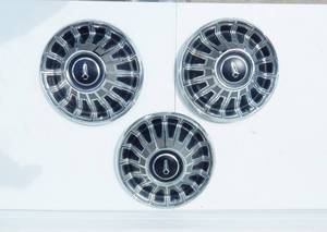 lot 178 image: Lot of Three Vintage Hubcaps