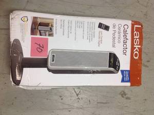 lot 70 image: Lasko 29 in. 1500-Watt Ceramic Pedestal Heater with Digital in good condition