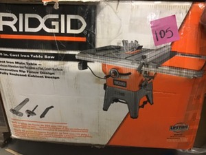 lot 105 image: RIDGID R4512 10 in. 13-Amp Cast IronTable Saw In good condition