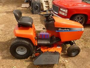 lot 1 image: Simplicity Lawn tractor. Hyrdrostatic drive. Needs Battery. 38 Deck. 12.5 HP Kohler Engine. Tested & works. Needs minor work on safety switches. As shown.