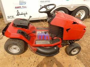 lot 6 image: Toro 38 lawn tractor. 12 HP Briggs & Stratton engine. Tested & works. Needs minor adjustment on drive belt. No battery. Hood is taped together. As shown.