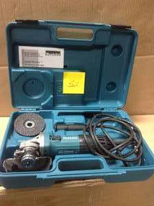 lot 132 image: Makita 6 Amp Corded 4 in. Lightweight Angle Grinder with Grinding Wheel, Wheel Guard Side Handle Hard Case in working conditions
