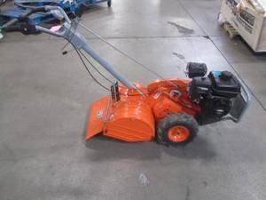 lot 5 image: Yardmax 18 in. 208cc Dual Rotating Rear Tine Tiller Briggs and Stratton YT4565