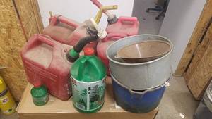 lot 225 image: Lot of Gas Cans, Chainsaw Bar Oil and More