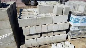 lot 128 image: Pallet of 83 Half Hollow Core Cinder Blocks