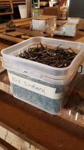 lot 52 image: Bucket of 10d Sinker Nails