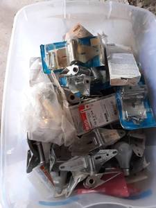 lot 193 image: Tote full of Garage Door Repair Hinges and More