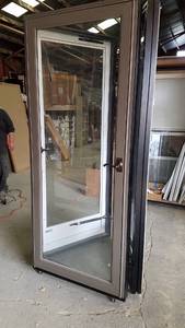 lot 440 image: Display 32 Glass Storm Door Complete w Handle and Closer