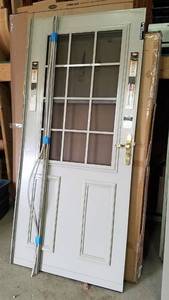 lot 444 image: 36 Storm Door W Frame and Lockset