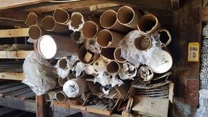 lot 482 image: Shelf Lot of Long Cardboard Tubes, Vinyl Siding, Aluminum Trim and More