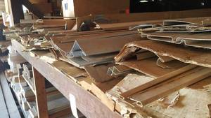 lot 498 image: Shelf Lot of (16) 2x6 Boards and Large Inventory of Vinyl Siding