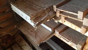 lot 502 image: 2 Shelves of engineered beams and Garage Door Panels