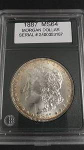 lot 7 image: 1887 Morgan Silver Dollar Graded FCI MS64