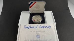 lot 55 image: 1991 USO Silver Dollars