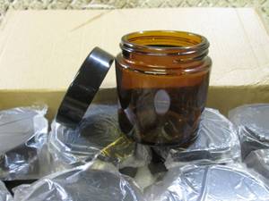 lot 9 image: Case of 12 Brown Glass 4oz Jars wit...