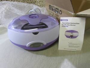 lot 39 image: Kolem Paraffin Wax Warmer with 2 Po...