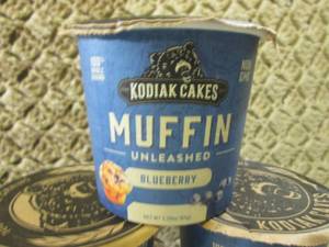 lot 134 image: 10 Kodiak Cakes Blueberry Muffin Un...