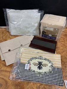 lot 26 image: Mixed Lot of Living Room Accessories Pillows with Removable Covers, Couch Cover, Flexi Arm Chair Table