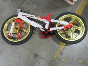 lot 314 image: Incomplete 18 Red Boys Mototrax by Schwinn With Mag Wheels - Missing Training Wheels, Seat, Pedals, Front Wheel Hardware, Handle Bars. S0803WMDS