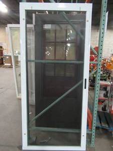 lot 623 image: Grisham White Aluminum Sliding Curtain Screen Door 36 x 80, SCRPA36WHT. - Small holes in screen.
