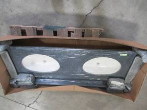 lot 338 image: Vanity Top, One Piece, Double White Basins, Pre-Drilled for 8 Spread, Charcoal Granite Look. Measures Approximately 61 X 22.