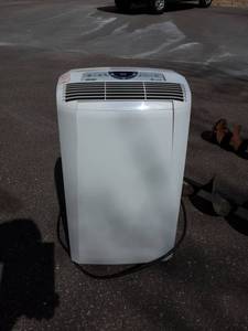 lot 31 image: PeLoghi Pinquino AC Unit For Inside Home. PAC CN120E. Works.