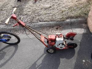 lot 5 image: Gopher EdgerTrimmer. Has Compression (No Gas To Test)