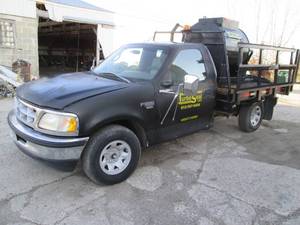 1998 Ford F250 XL Triton V8 flatbed truck with 200 Gallon sprayer tank pump.