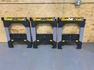 lot 34 image: DEWALT - Lot of 3 folding Sawhorse with adjustable metal legs.