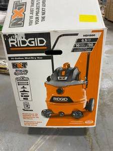 lot 74 image: RIDGID 16 Gallon 6.5 Peak HP NXT WetDry Shop Vacuum w cart, fine dust filter, hose and accessories