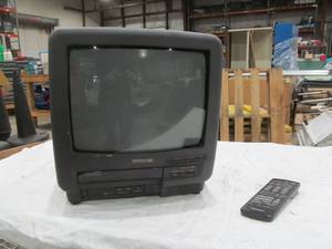 lot 496 image: Panasonic TV with built in vcr remote