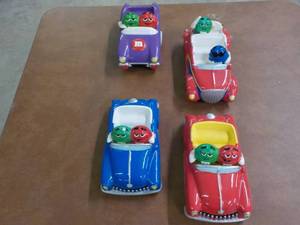 lot 42 image: Ceramic M & M Cars- one is damaged...