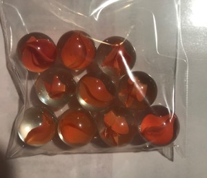lot 122 image: 10 Red Cats Eye Marbles