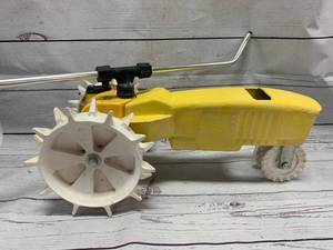 lot 87 image: Vintage Cast Iron Tractor Sprinkler