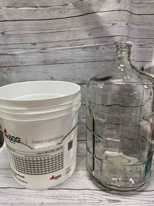 lot 92 image: Wine Making Supplies - 6 Gallon Glass Carboy & 7.8 Gallon Bucket