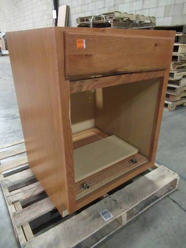 lot 102 image: Hampton Assembled 24x34.5x24 in. Base Kitchen Cabinet with Ball-Bearing Drawer Glides in Medium Oak KB24-MO